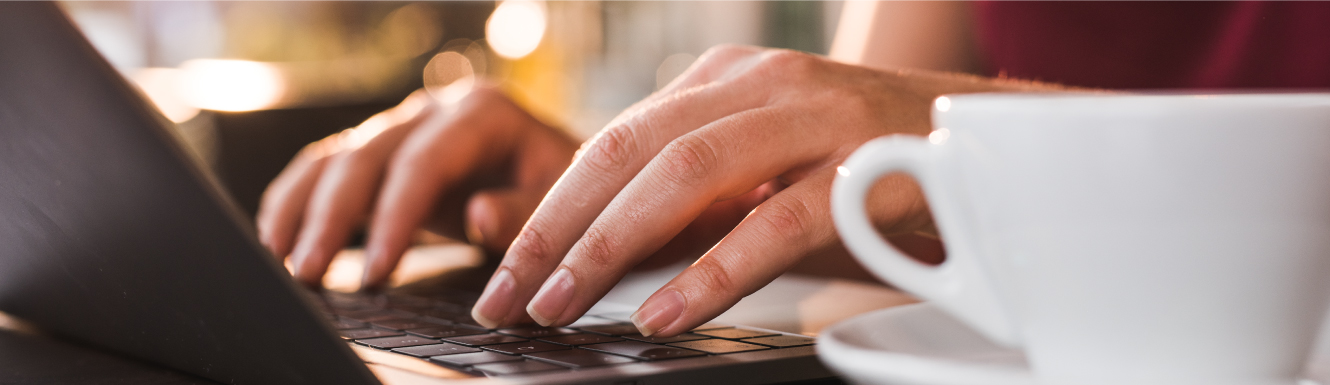 hands typing on a keyboard